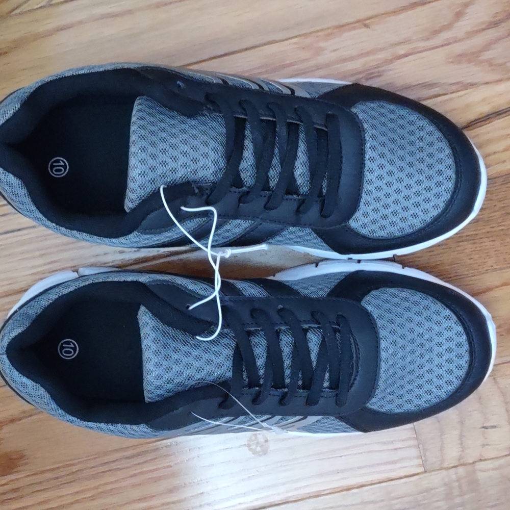 Men's lace up tennis shoes.